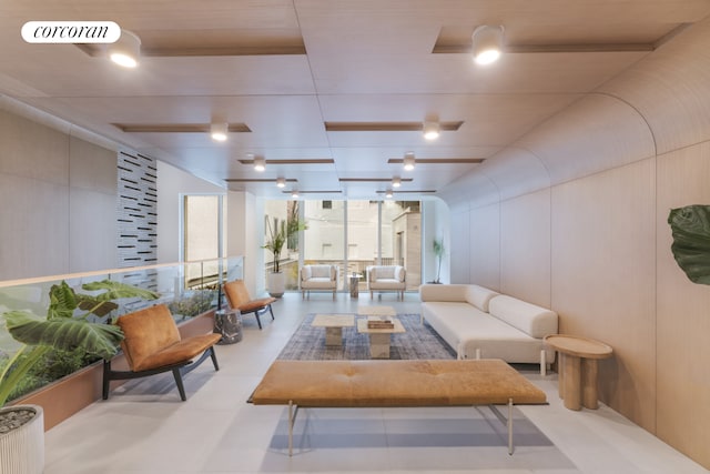 living room featuring a wall of windows and visible vents