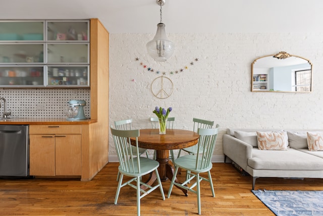 dining space with dark hardwood / wood-style flooring