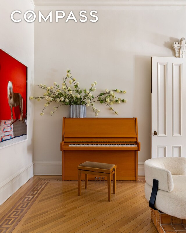 sitting room with hardwood / wood-style floors