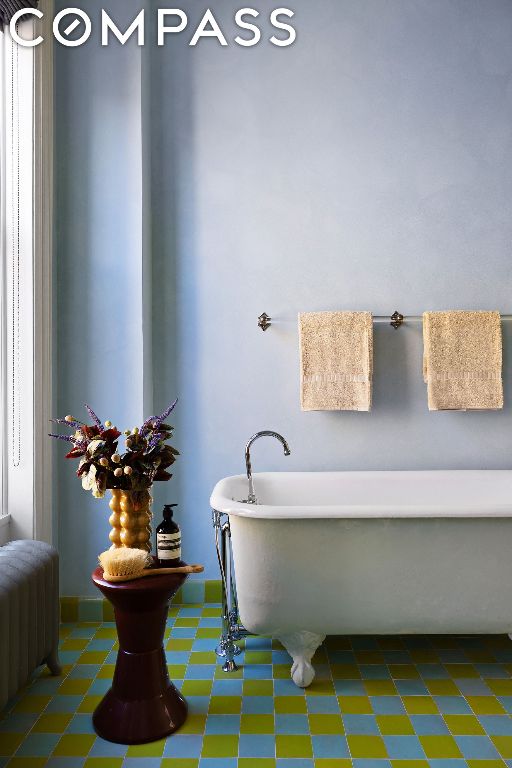 bathroom featuring a washtub