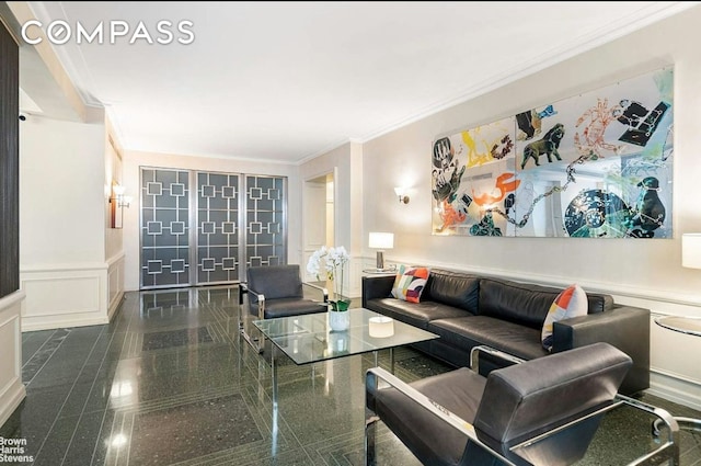 440 E 56th St Unit 8C, New York City, NY 10022 - living area featuring a decorative wall, crown molding, a wainscoted wall, and granite floors