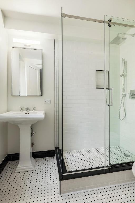 bathroom with a shower with shower door