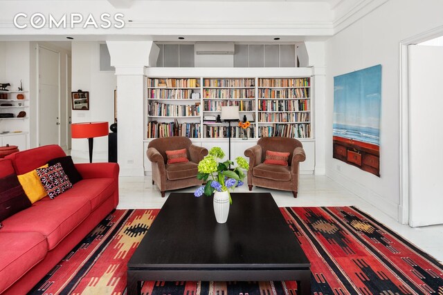 living area with an AC wall unit