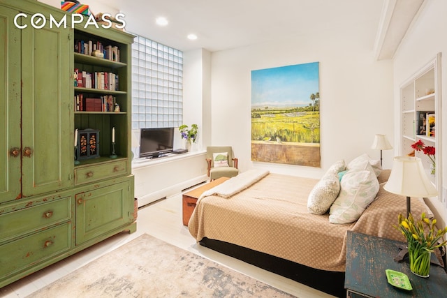 bedroom featuring light wood-type flooring and recessed lighting