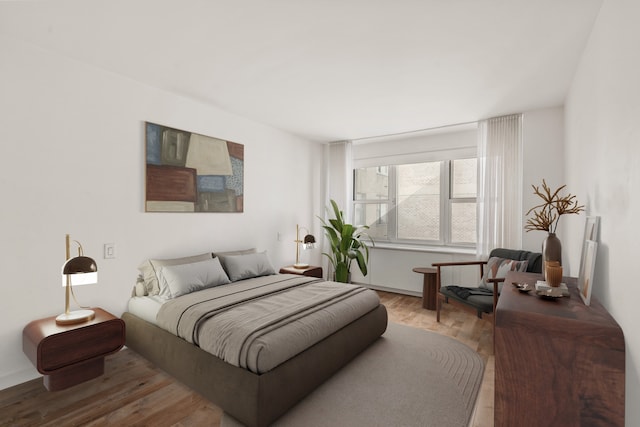 bedroom with wood finished floors