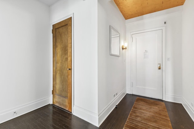 interior space featuring dark wood-style floors and baseboards