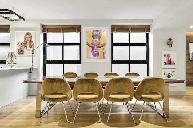 dining space with light wood-type flooring