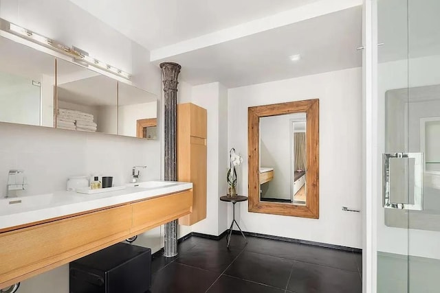 bathroom featuring vanity, tile patterned floors, and walk in shower