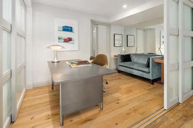 living room with a healthy amount of sunlight and a wall of windows