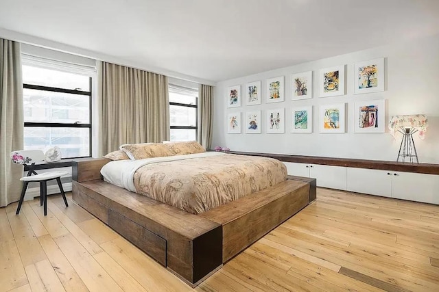 bedroom with light wood-type flooring