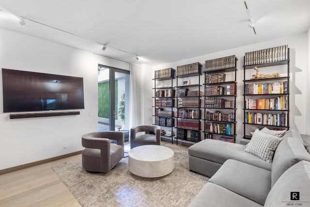 sitting room featuring light hardwood / wood-style flooring and rail lighting