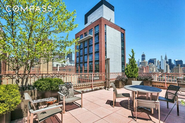 235 E 22nd St Unit 15U, New York City, NY 10010 - view of patio with a skyline view