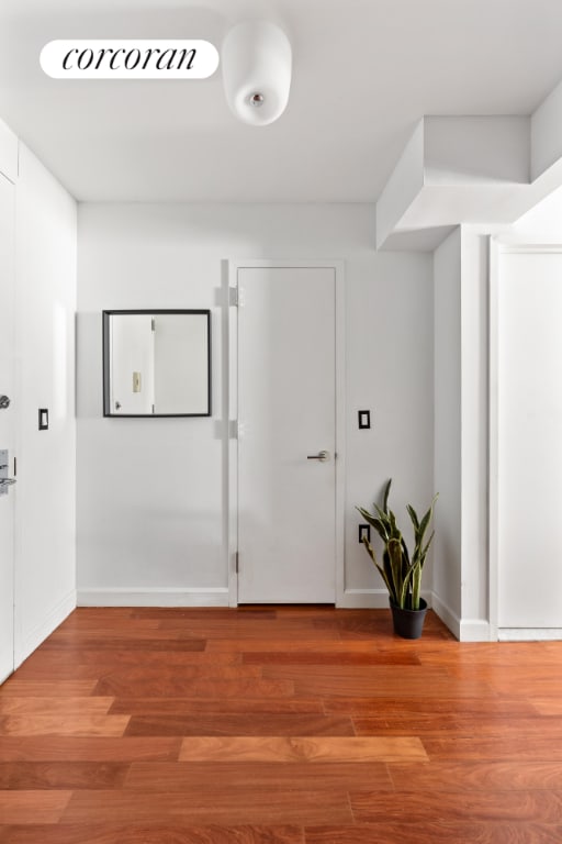 unfurnished room featuring hardwood / wood-style flooring