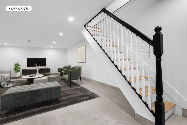 living room featuring recessed lighting, visible vents, baseboards, and stairs