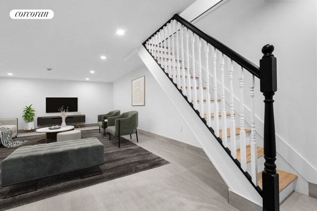 living area featuring visible vents, recessed lighting, stairs, and baseboards
