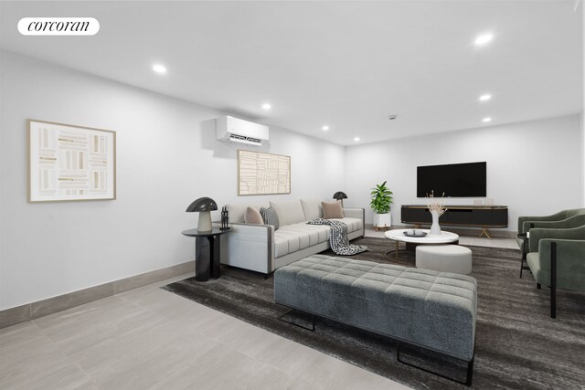 living area with visible vents, recessed lighting, and an AC wall unit