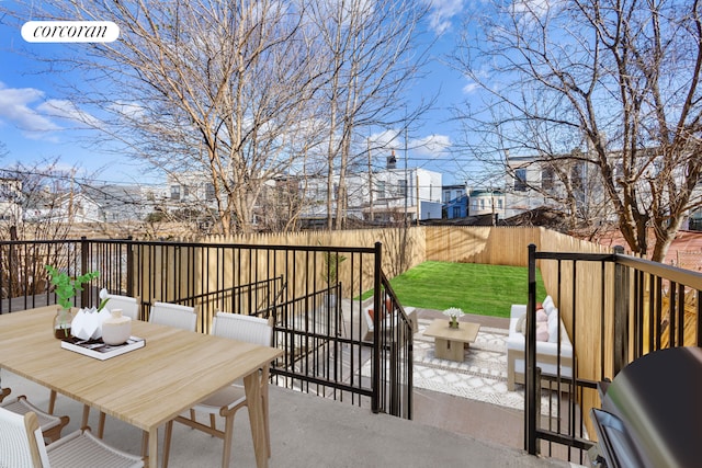 view of patio / terrace with outdoor dining space and a fenced backyard