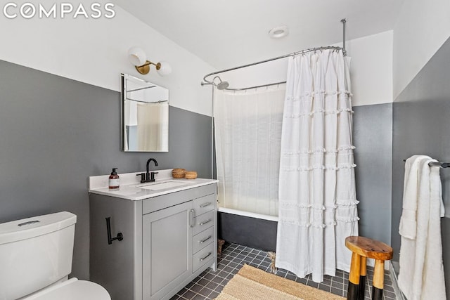 full bathroom with tile patterned flooring, toilet, vanity, and shower / bath combination with curtain