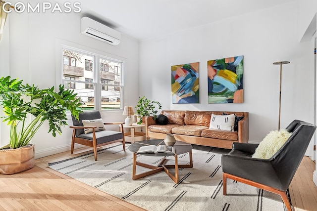 living room with hardwood / wood-style flooring and a wall mounted air conditioner