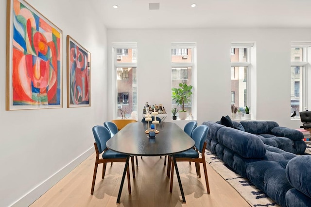 dining area featuring light wood-style floors, recessed lighting, and baseboards