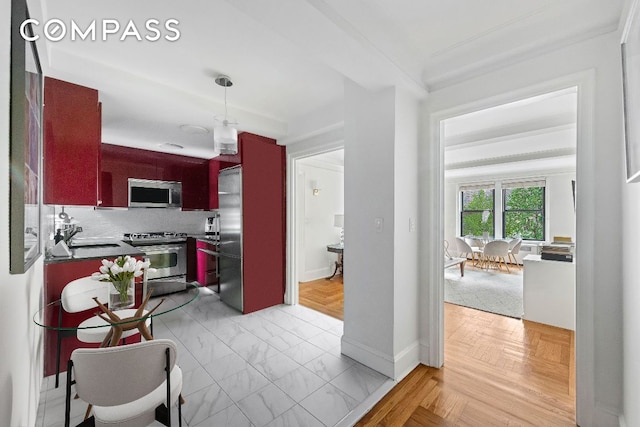 kitchen featuring sink, decorative backsplash, light parquet flooring, and stainless steel appliances