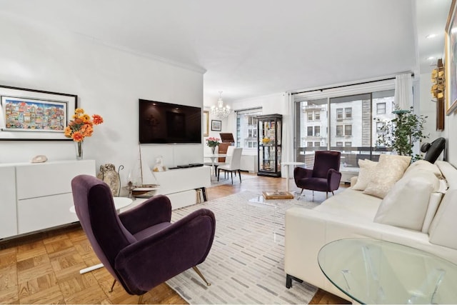 living room with light parquet floors and an inviting chandelier