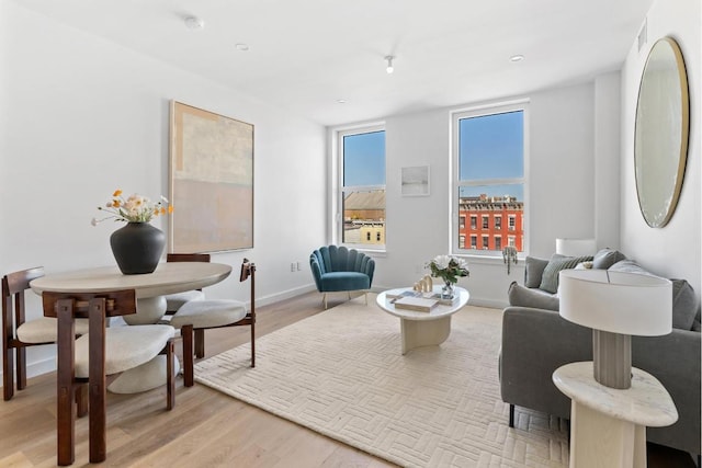 living room featuring light wood-style floors and baseboards