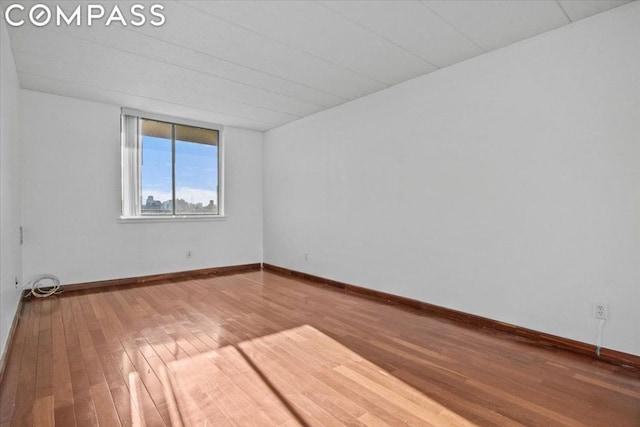 spare room featuring hardwood / wood-style floors