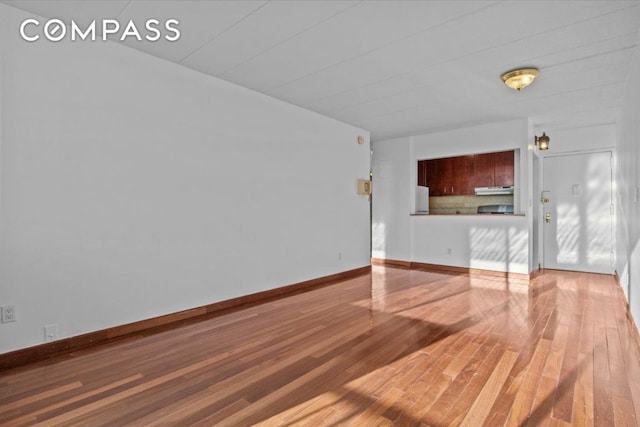 unfurnished living room with light wood-type flooring