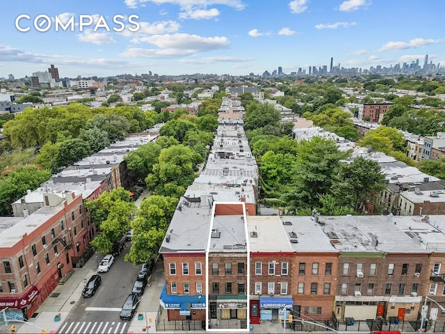 birds eye view of property featuring a view of city