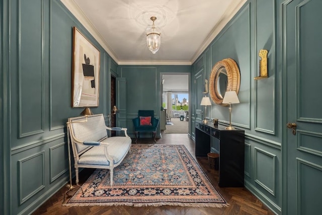 living area with crown molding and dark parquet floors