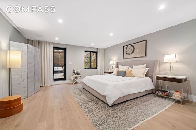 bedroom featuring light wood-style flooring, baseboards, access to outside, and recessed lighting