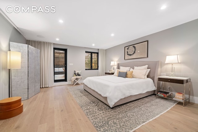 bedroom featuring light wood-type flooring, access to outside, recessed lighting, and baseboards