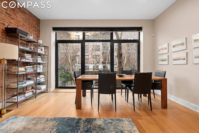 dining area with light hardwood / wood-style flooring