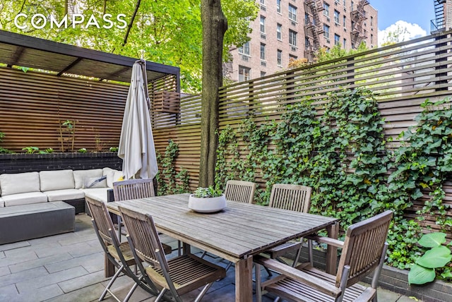 view of patio / terrace featuring an outdoor hangout area and outdoor dining space