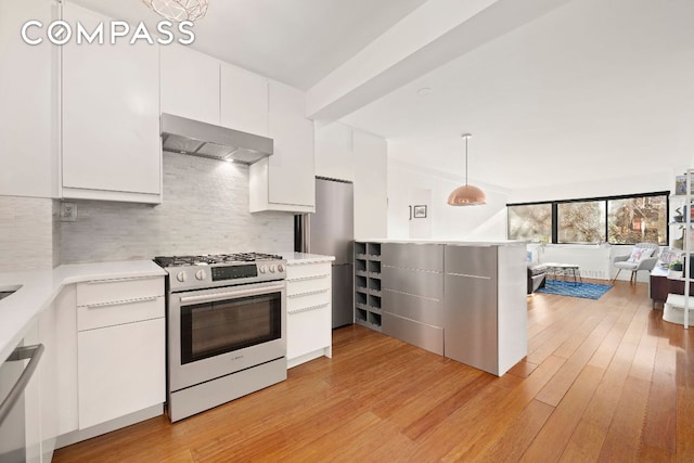 kitchen with white cabinetry, light hardwood / wood-style flooring, hanging light fixtures, appliances with stainless steel finishes, and exhaust hood