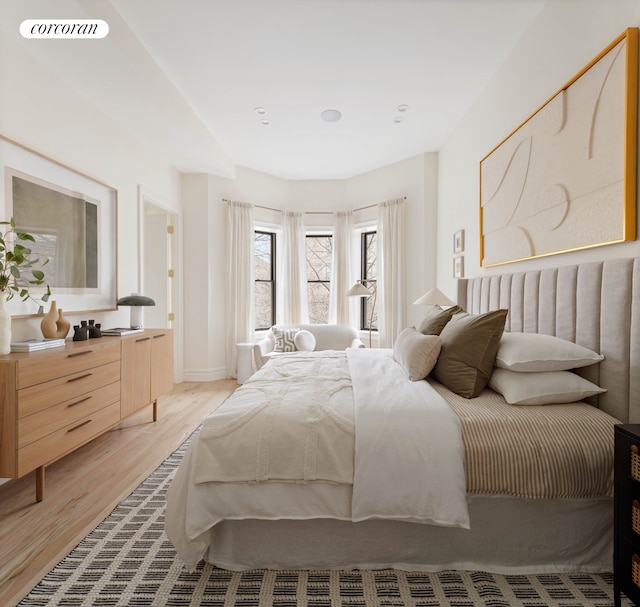 bedroom with visible vents and light wood-style flooring