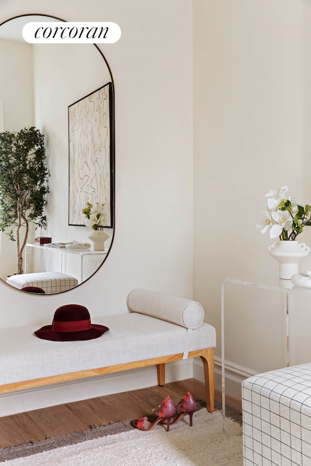 interior space with wood finished floors and baseboards