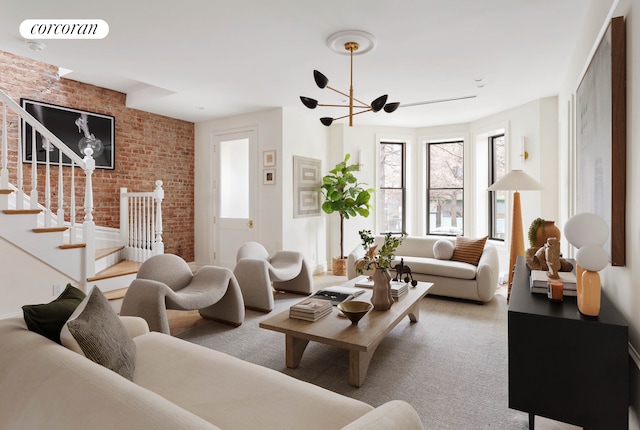 living area with carpet floors, visible vents, stairway, and brick wall