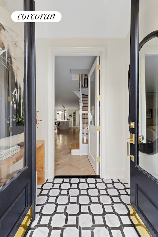 interior space featuring baseboards and stairs