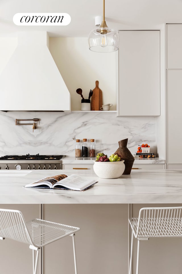 bar with premium range hood and tasteful backsplash