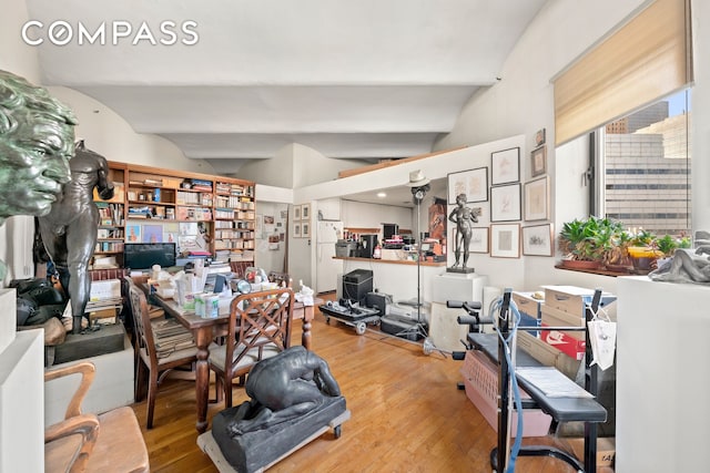57 Warren St Unit 7, New York City, NY 10007 - home office featuring vaulted ceiling and wood-type flooring