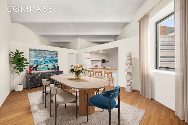 57 Warren St Unit 7, New York City, NY 10007 - dining room with light wood-type flooring and lofted ceiling