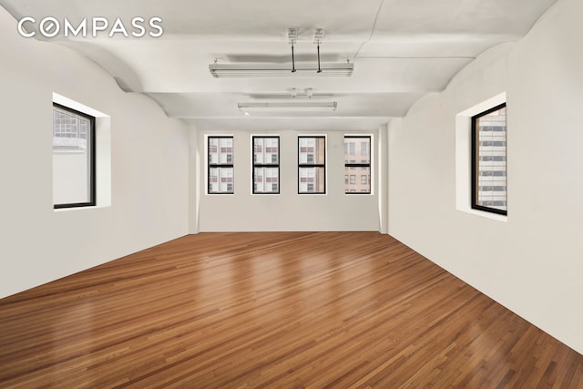 57 Warren St Unit 7, New York City, NY 10007 - empty room with wood finished floors and healthy amount of natural light