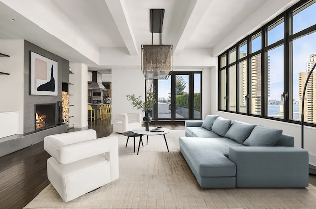 143 Reade St Ph, Ph, New York City, NY 10013 - living room with light wood-type flooring and a lit fireplace