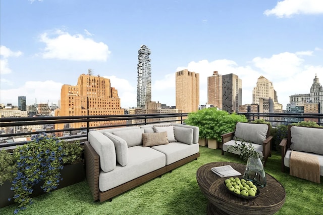 balcony featuring a view of city and an outdoor hangout area