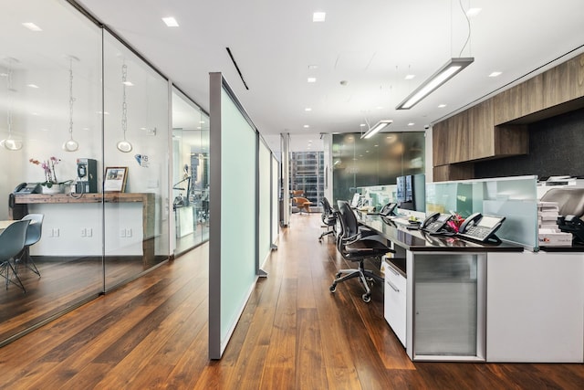 50 W 47th St Unit 1808, New York City, NY 10036 - kitchen with modern cabinets, dark wood-style flooring, brown cabinets, and a wall of windows