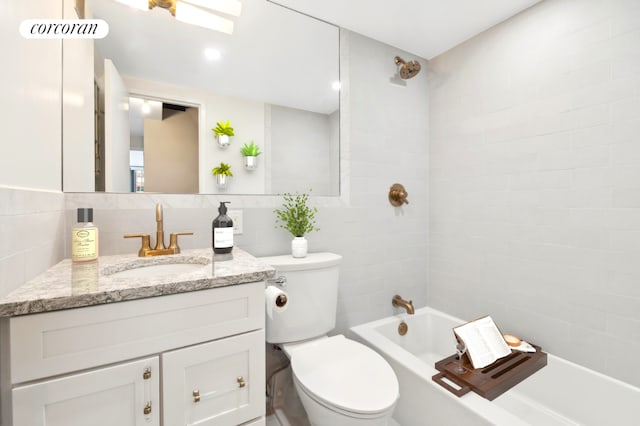 full bathroom featuring bathtub / shower combination, tile walls, backsplash, vanity, and toilet