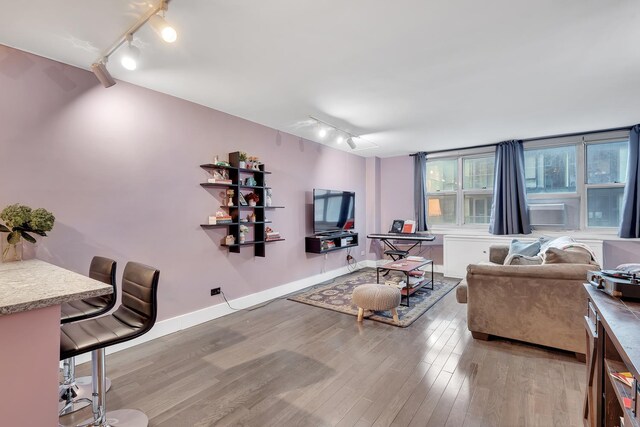 living room featuring track lighting and light hardwood / wood-style floors