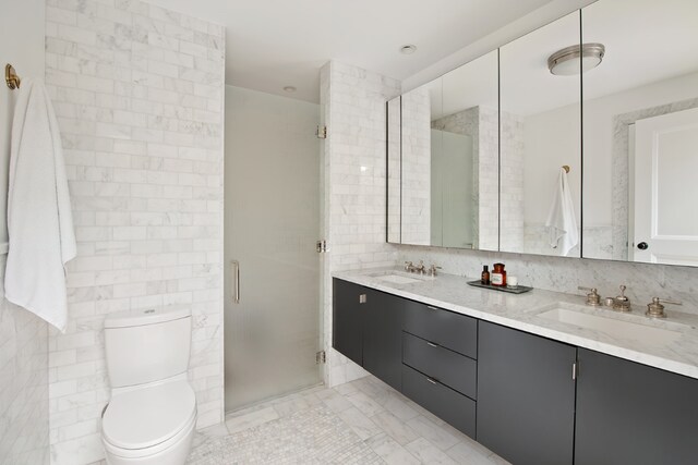 bathroom featuring tile walls, decorative backsplash, vanity, walk in shower, and toilet